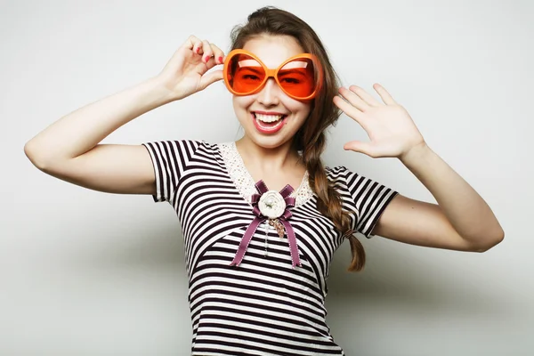 Young woman with big party glasses