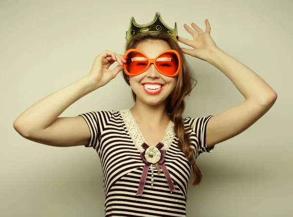Young woman with big party glasses