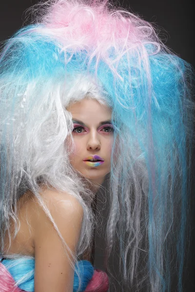 fashion model with bright make up and colorful hair