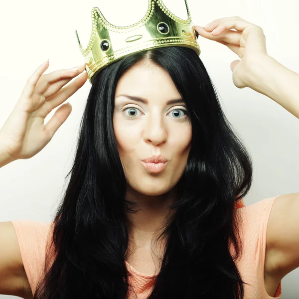 Happy young lovely woman with crown