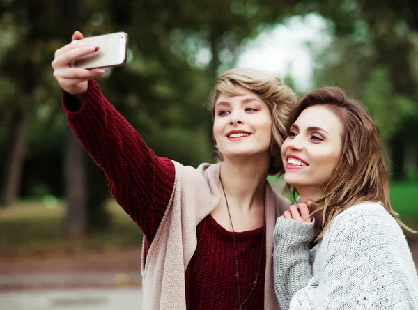 Young women making selfie
