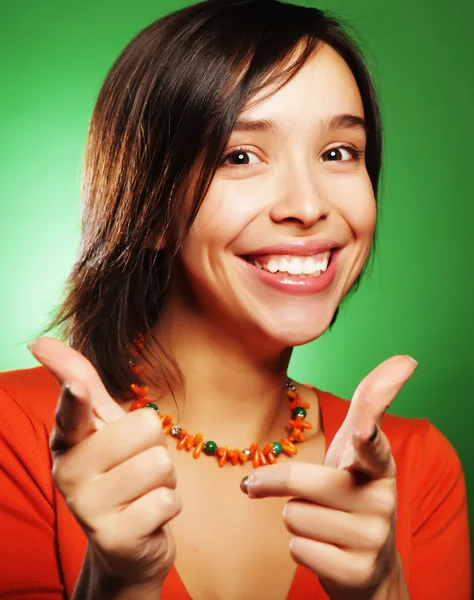 Young expression woman over green background