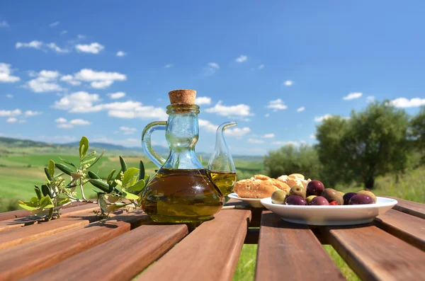 Olive oil, olives and bread in Tuscan