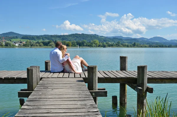 Couple on wooden jetty