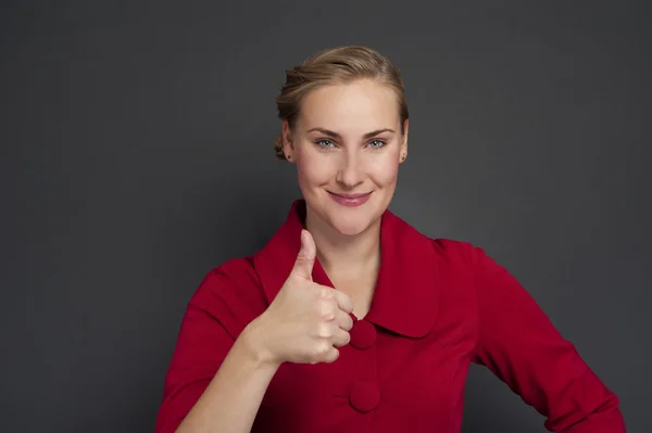 Smiling business woman thumb up show. isolated dark background