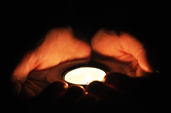 Tea light Candle in hands