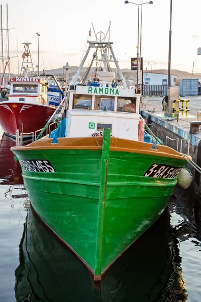 Fishing motor boat on the harbor in Palamos bay of Spain