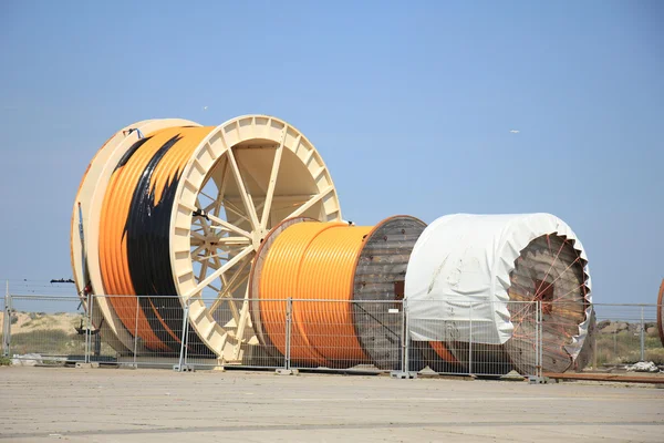 Industrial cables on large wooden reels