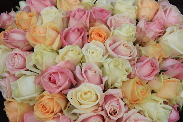 Pastel roses in a wedding arrangement
