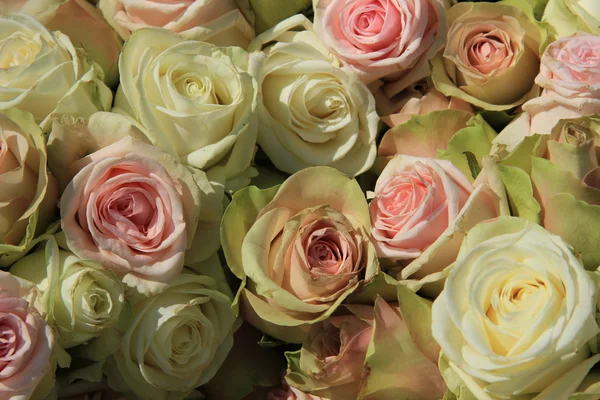 White and Pink roses in wedding arrangement