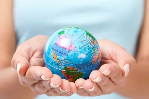 Woman\'s hands with globe