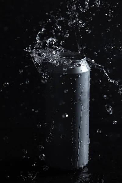 Beer can with water splashes