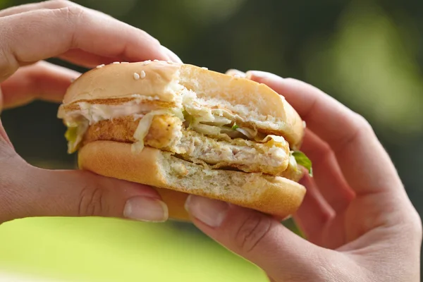 Hamburger in woman hands
