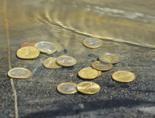 Coins under water