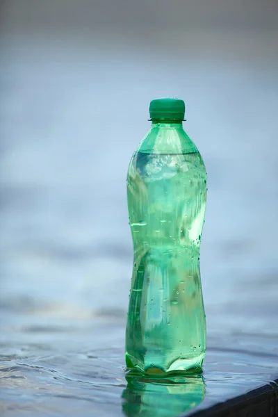 Water in green bottle