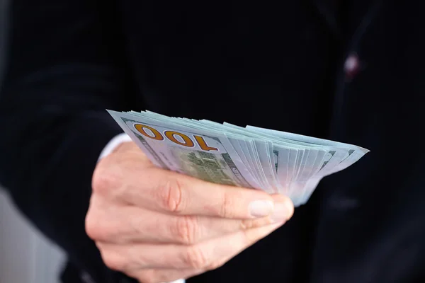 Businessman holding banknotes
