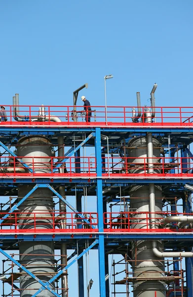 Workers on new refinery construction site