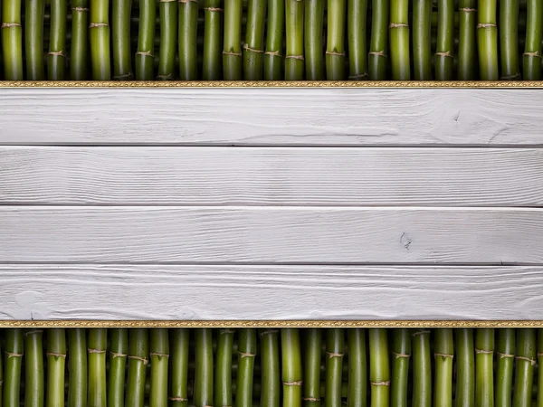 Wooden planks on bamboo stick background