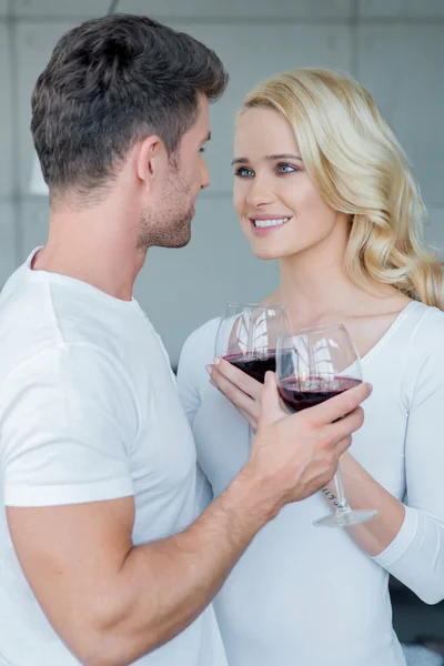 Loving couple enjoying a romantic glass of wine