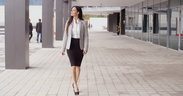 Businesswoman walking near office building