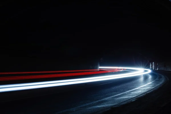 Light trails in tunnel. Art image. Long exposure photo taken in