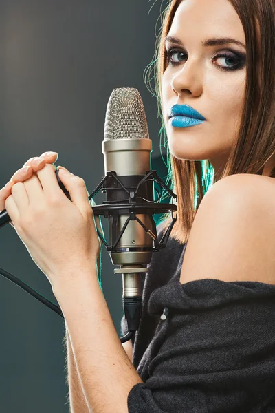 Beautiful woman with microphone.