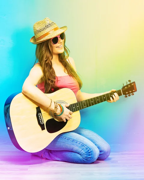Woman sings and playing guitar