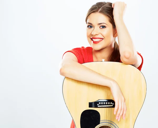 Smiling woman with acoustic guitar