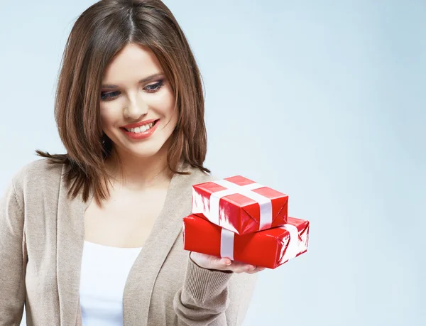 Woman holds red gift boxes