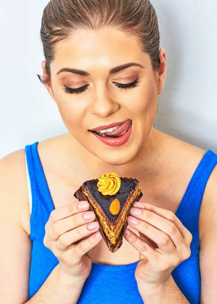 Beautiful woman eating cake