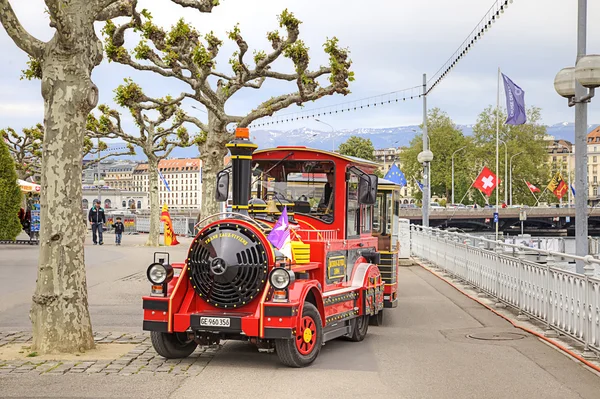 Geneva. Children Road train ashore lake