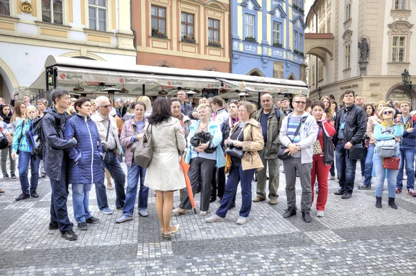 Prague. The guide speaks with tourists