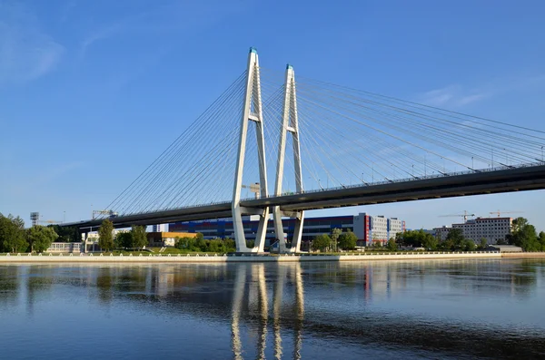 A big white bridge through the river Neva in Saint Petersburg