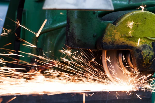 Sparks from grinding machine.