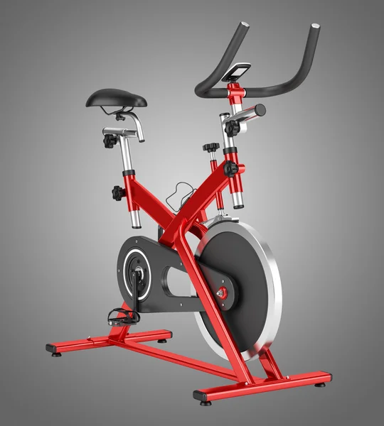 Stationary exercise bike isolated on gray background