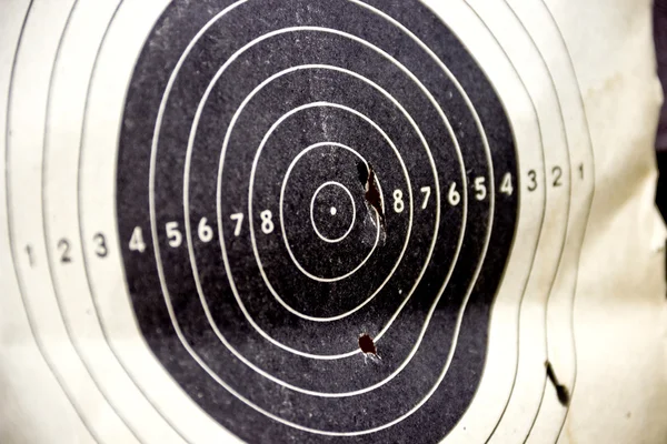 Sport target with bullet holes