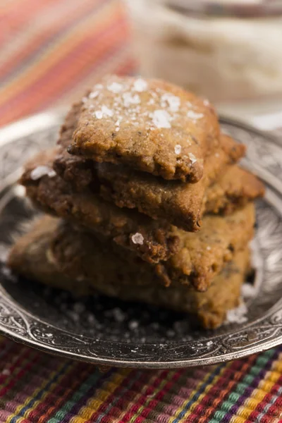 Spanish snack crackers with black olives and anchois