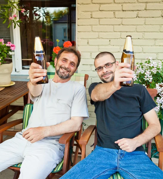 Father and son drinking beer
