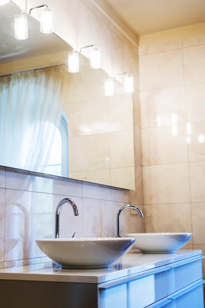 Closeup of water-supply faucet in modern bathroom