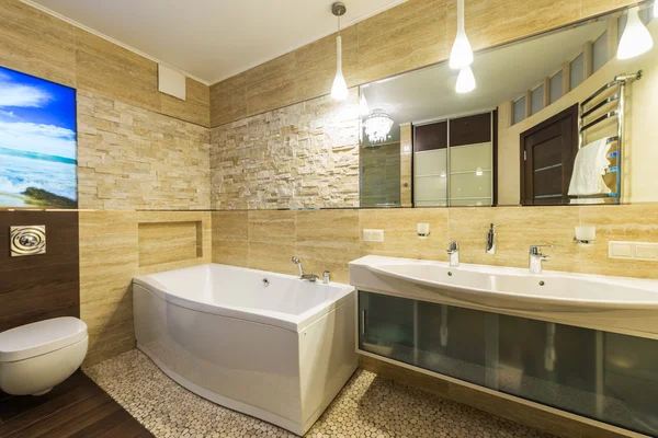 Bathroom in luxury home with bath and furniture