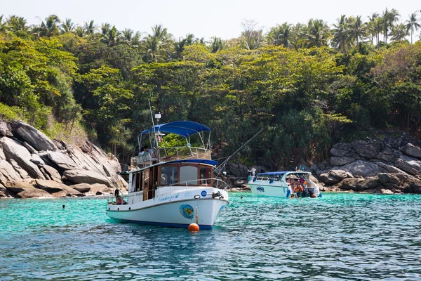 Small boats with tourists of the island of Phi Phi, Andaman Sea,