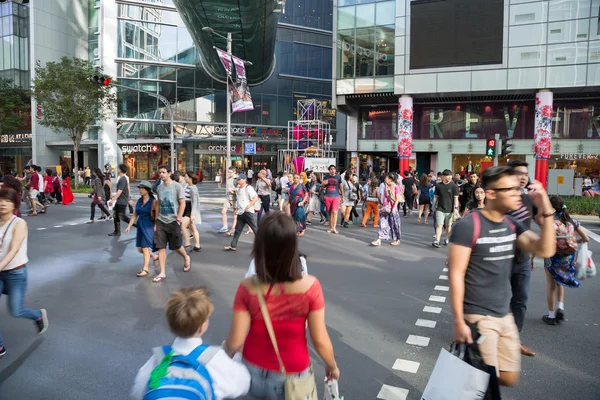 People on a pedestrian crossing on Orchard Road