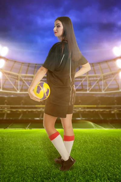 Woman soccer player on stadium