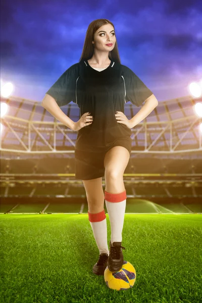 Woman soccer player on stadium