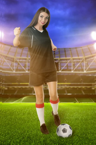Woman soccer player on stadium