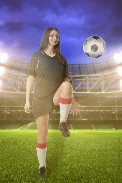 Woman soccer player on stadium