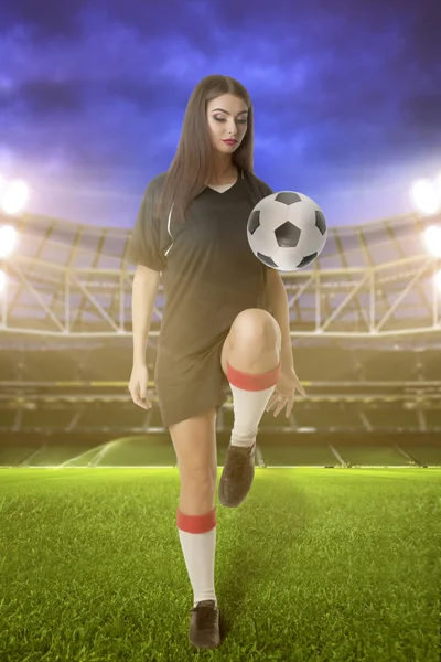 Woman soccer player on stadium