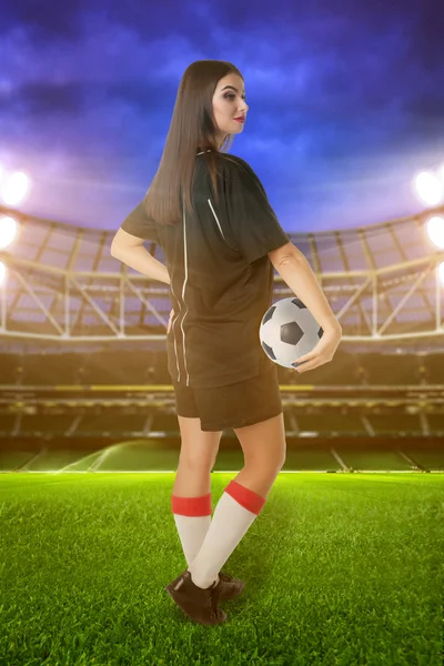 Woman soccer player on stadium