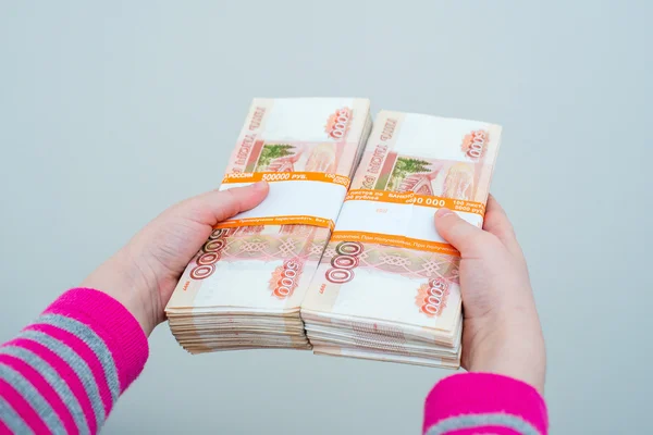 Closeup human\'s hands holding russian rubles