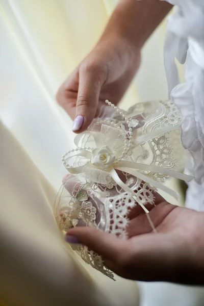 Garter on the leg of a bride, Wedding day moments